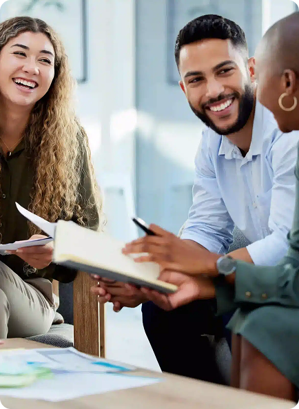 Two team members smiling